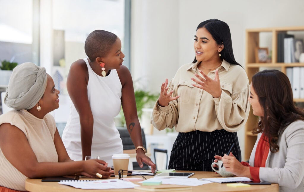 group of young business women brainstorming