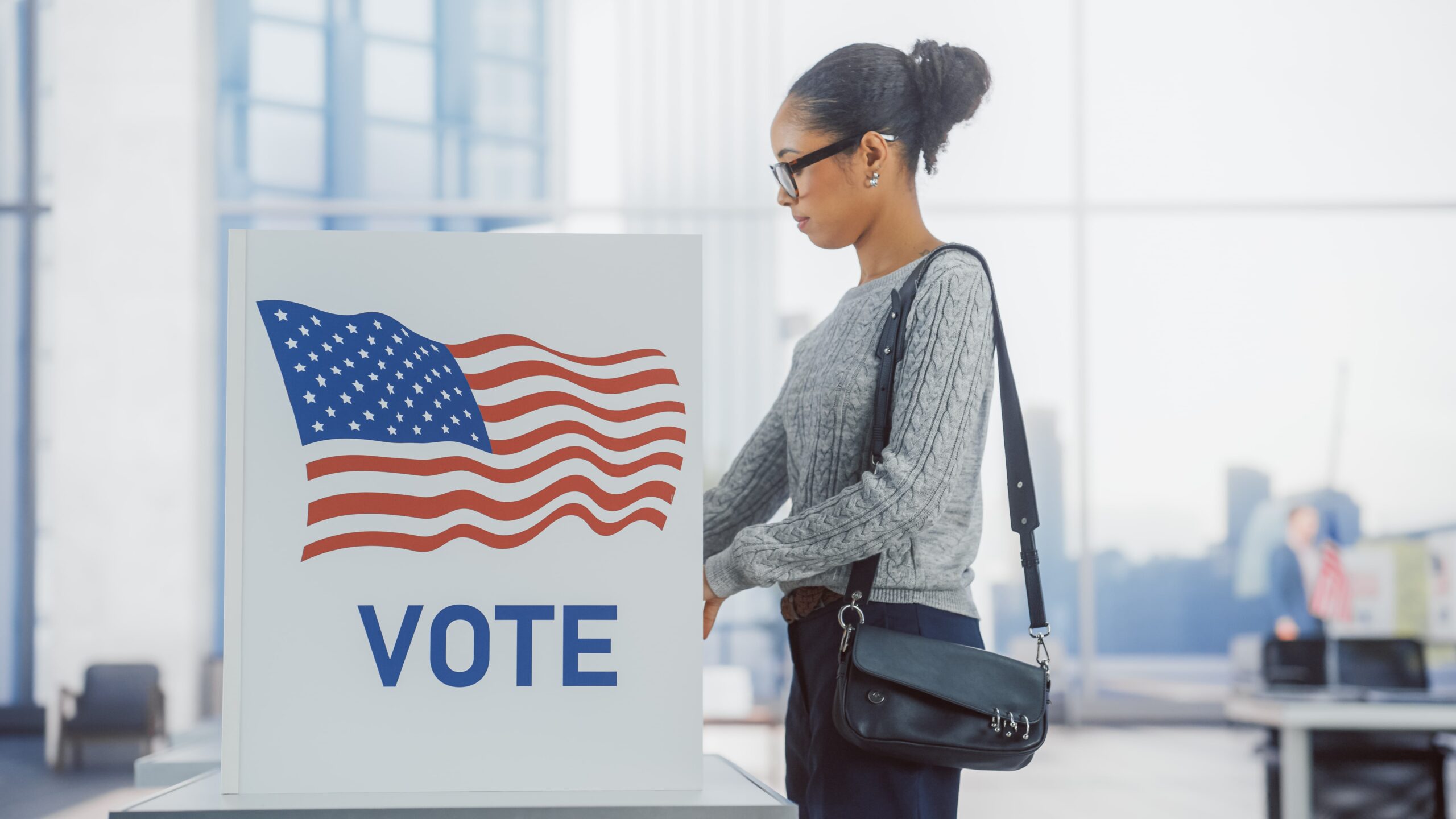Woman casting a vote at her local polling place